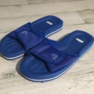 Blue slide sandals w/white stripe around sole & sailboat on Velcro strap size 8